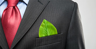 man wearing suit with leaf in pocket sustainability