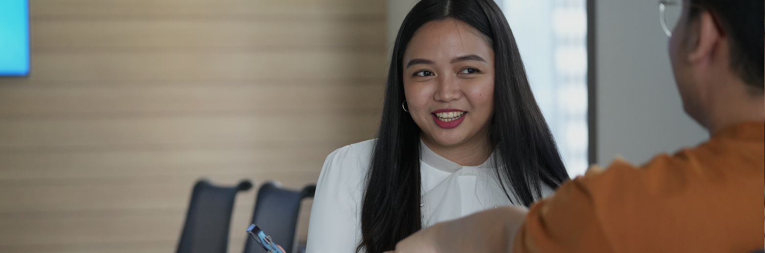 Nasdaq Manila employees in meeting room