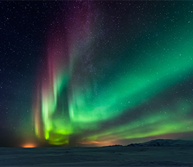 Landscape photograph of an aurora borealis.