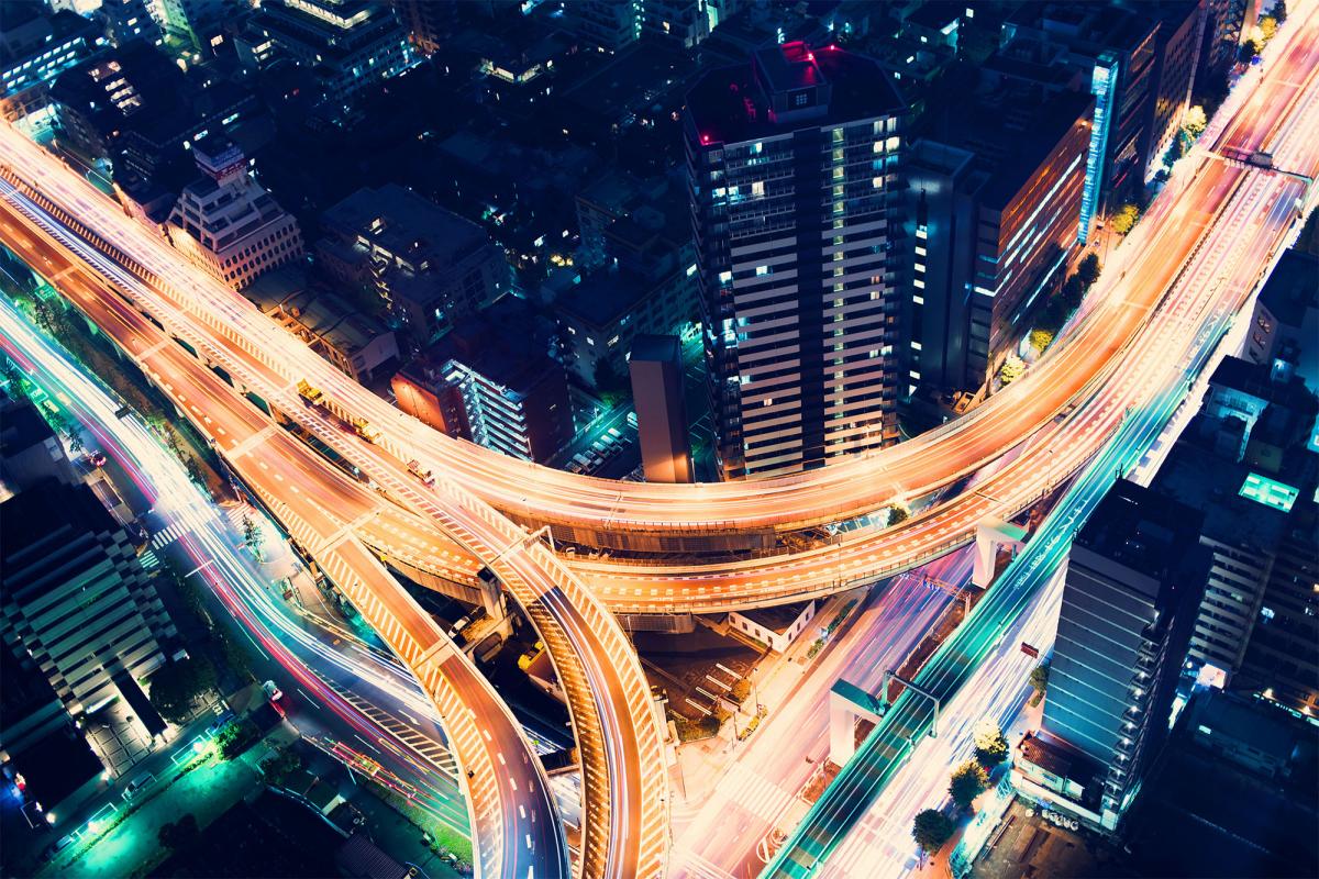 Aerial view of brightly light and deserted highway intersection at night, Shinjuku, Tokyo, Japan