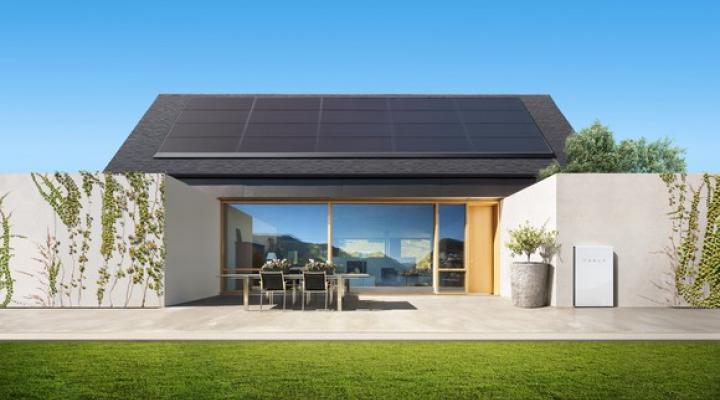 A house equipped with Tesla solar panels and a Powerwall