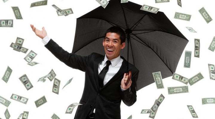 Money Raining Down On Man With Unbrella