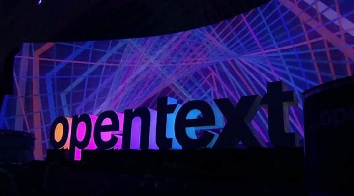 The Open Text logo against a colorful background.