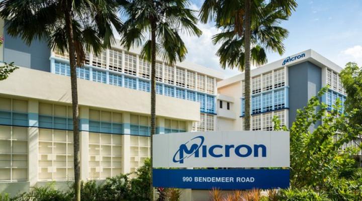 Micron logo on a sign in front of an office building.