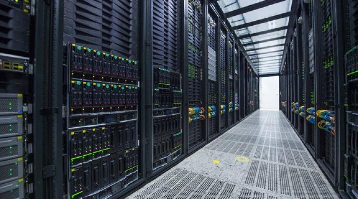 Row of Nokia servers on both sides of a clear aisle with metallic flooring.