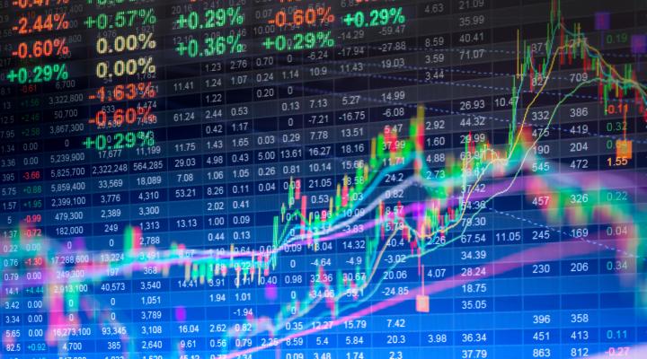 Stock market data and charts on a colorful LED display