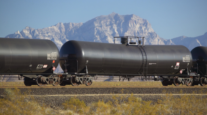 Tank car with mountain backdrop.