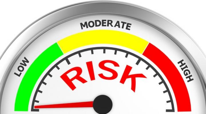 Risk meter with needle pointing to low risk