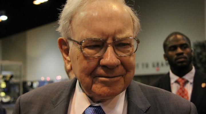 Warren Buffett talks to reporters about his recent buys.