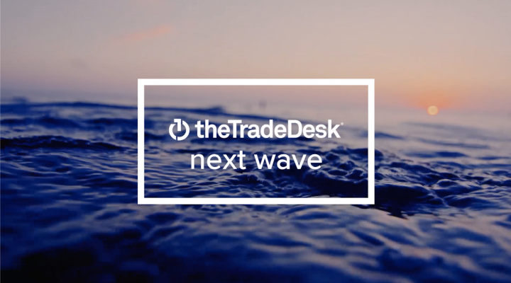 The Trade Desk logo with the words Next Wave below the company name.