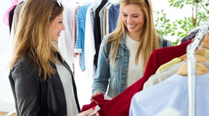 Two women shopping for clothes.