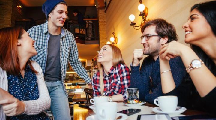 Group of young adults at a restaurant table