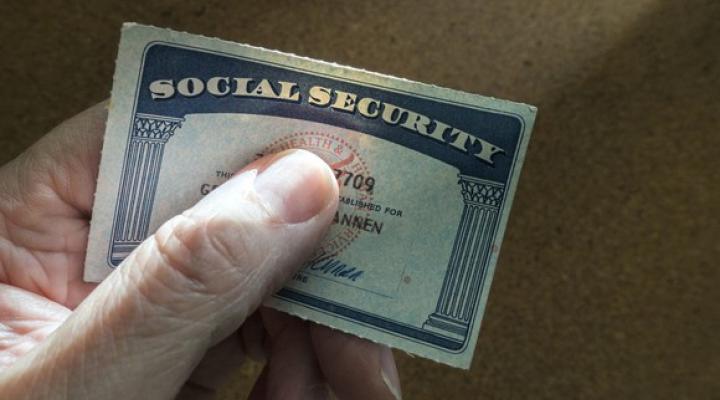 Senior holding Social Security card.