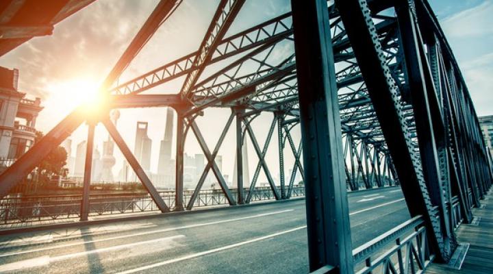 A steel bridge lit by a shaft of sunlight