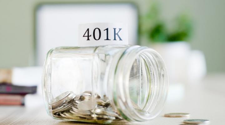 Savings jar for 401(k) filled with coins