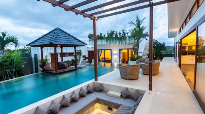 Tropical resort villa with a narrow rectangular pool