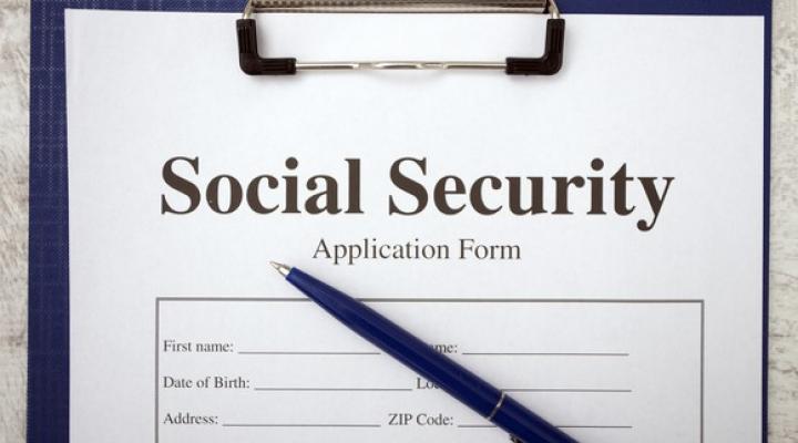 Top half of form on clipboard that says social security application form