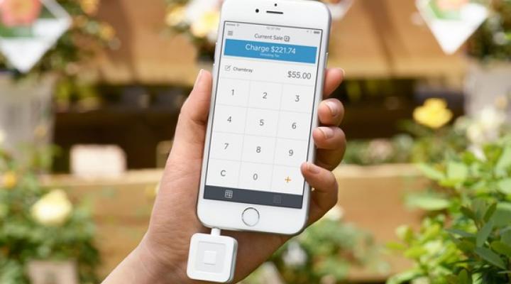 Square's mobile credit card reader attached to an iPhone.