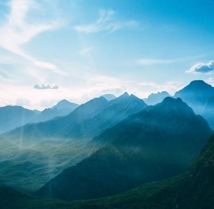 Mountains and clouds under blue sky