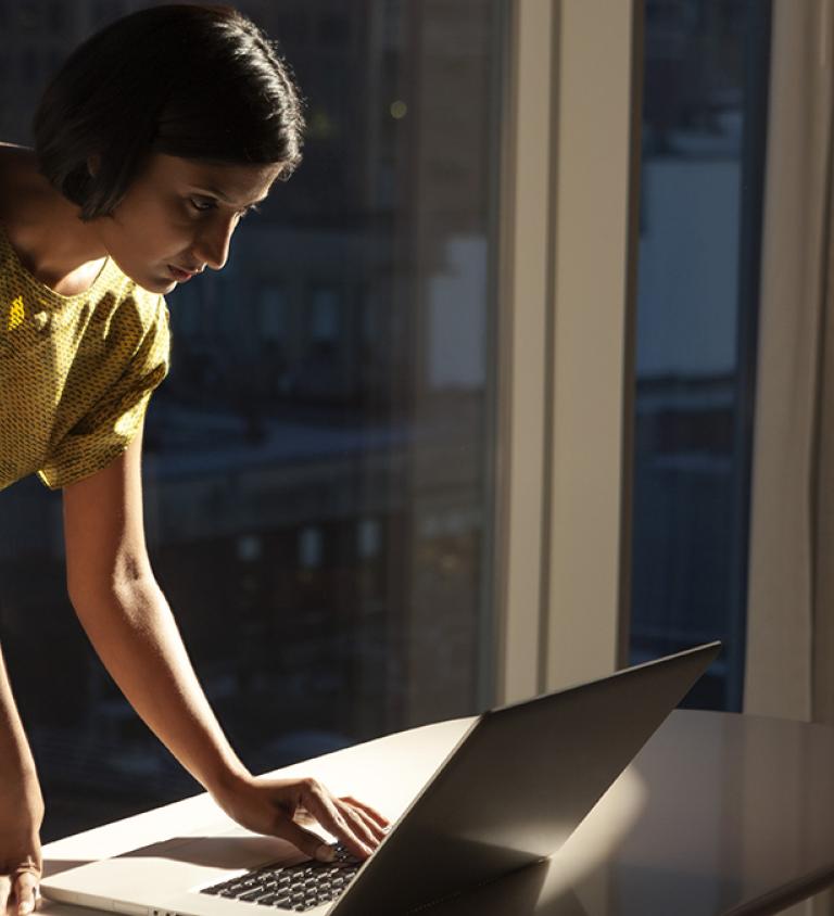 Woman on computer at night